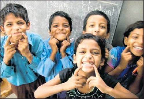 Children pointing to smiles.jpg